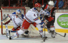 Windsor’s Ben Johnson, right, is checked by Kitchener’s Ben Fanelli in front of goalie Jordan DeKort at the WFCU Centre. (DAN JANISSE/The Windsor Star)