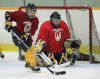 Jenny MacKnight, left, handles the puck in front of goaltender Karlyle Robinson at South Windsor Arena. (JASON KRYK/ The Windsor Star)