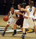 The University of Windsor's Miah-Marie Langlois, left, cuts around McMaster's Rachael Holmes with teammate Kim Moroun setting the pick at the St. Denis Centre last year. (TYLER BROWNBRIDGE/The Windsor Star)