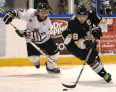 LaSalle's Dylan Denomme, right, is checked by Sarnia's Bobby King at the Vollmer Centre. (DAN JANISSE/The Windsor Star)