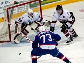 Spitfires forward Remy Giftopoulos, left, tries to score a goal on Guelph goalie Justin Nichols at the WFCU Centre. (JOEL BOYCE/The Windsor Star)