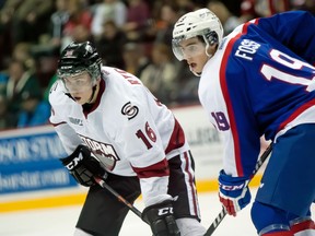 Tecumseh's Kerby Rychel, left, lines up for a faceoff against Ryan Foss of the Spitfires Saturday at the WFCU Centre. (JOEL BOYCE/The Windsor Star)