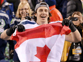 Seattle Seahawks tight end Luke Willson holds up a Canadian flag after the NFL Super Bowl XLVIII football game against the Denver Broncos, Sunday, Feb. 2, 2014, in East Rutherford, N.J. The Seahawks won 43-8. (AP Photo/Kathy Willens)