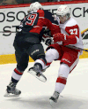 Windsor’s Ty Bilcke, checks, Michael Bunting of the Greyhounds at the WFCU Centre. (TYLER BROWNBRIDGE/The Windsor Star)