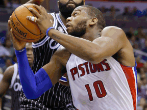 Detroit's Greg Monroe, right, is guarded by Orlando's Kyle O'Quinn Wednesday. (AP Photo/John Raoux)