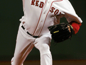 Boston's Curt Schilling pitches against the Colorado Rockies at Fenway Park. (Photo by Jim McIsaac/Getty Images)