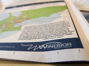 A copy of the National Post is seen in Windsor on Wednesday, February 26, 2014. The City of Windsor has taken out a half page ad urging support for the auto sector.                 (TYLER BROWNBRIDGE/The Windsor Star)