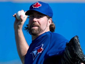 Blue Jays pitcher R.A. Dickey throws at spring training in Dunedin, Fla., Tuesday, February 18, 2014. (THE CANADIAN PRESS/Frank Gunn)