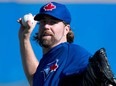 Blue Jays pitcher R.A. Dickey throws at spring training in Dunedin, Fla., Tuesday, February 18, 2014. (THE CANADIAN PRESS/Frank Gunn)