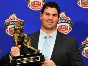 Tecumseh's Josh Bourke shows off his award as the CFL's Most Outstanding Offensive Lineman in 2011. Bourke signed a new deal with the Montreal Alouettes Tuesday.