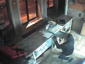 An image from a surveillance video recording of a break-in at 3392 Dougall Ave., during the early morning hours of Jan. 18, 2014. (Handout / The Windsor Star)