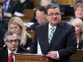 In this file photo, Minister of Finance Jim Flaherty tables the federal budget in the House of Commons on Parliament Hill in Ottawa on Tuesday, February 11, 2014. (Fred Chartrand/The Canadian Press)