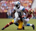 Detroit's Nate Burleson, front, is tackled by Washington's David Amerson last season in Landover, Md. Burleson was released by the Lions Wednesday. (Patrick McDermott/Getty Images)