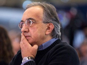 Sergio Marchionne, Chrysler's CEO, listens to a speech at the Canadian International Auto Show in Toronto , on Thursday February 13 , 2014. THE CANADIAN PRESS/Chris Young