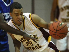 Catholic Central's Isaiah Familia scored a game-high 19 points as the Comets beat the Herman Green Griffins 60-44 Sunday night in the WECSSAA senior boys Tier I basketball final at the WFCU Centre. (DAX MELMER/The Windsor Star)