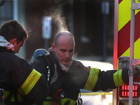 Windsor firefighters are shown at the scene of an apartment fire Thurs. Feb. 27, 2014, in the 200 block of Erie St. in Windsor, Ont. (DAN JANISSE/The Windsor Star)