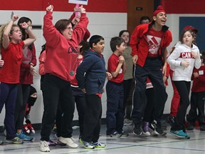 Students cheer on their teammates during an Olympic themed event Fri. Feb. 7, 2014, at the First Lutheran Christian Academy in Windsor, Ont. The students competed in an variety of fitness challenges to celebrate the kick-off of the Olympic games.  (DAN JANISSE/The Windsor Star)