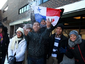 International students from Panama, from left, Glicerie Gomez, 20, Gloria Dominguez, 19, Brian Francois, 20, Francisco Cedeno, 18, Abdi Rodriguez, 19, and Yaneth Laffaurie, 20, throw around the snow while at St. Clair College, Friday, Feb. 7, 2014.  For some of them it was the first time seeing snow.  (DAX MELMER/The Windsor Star)