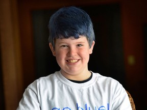 Nicholas Lavin, 10, is a cancer  survivor who has dyed his hair blue to raise money for the Go Blue Go Bald head shave event Feb. 27 in Windsor for Make A Wish Southwestern Ontario. (DAN JANISSE/The Windsor Star)