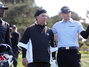Actors Don Cheadle, left, and Andy Garcia, centre, and PGA golfer Brendan Steele chat during the first round of the AT&T Pebble Beach National Pro-Am at Spyglass Hill Golf Course on February 6, 2014 in Pebble Beach, Calif.  (Christian Petersen/Getty Images)