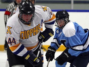 Kennedy's Colin Robinson, left, cuts around Massey's Steven Shields during high school hockey at Adie Knox Arena Monday, February 3, 2014. (TYLER BROWNBRIDGE/The Windsor Star)