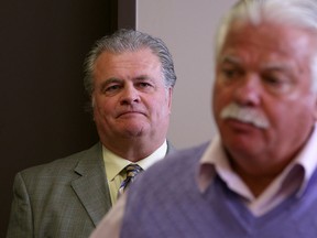 Charlie Hotham, left, president of Hotham Building Materials Inc., listens while Percy Hatfield, Windsor-West MPP speaks at a press conference announcing that Hotham is launching legal action against Freyssinett over money owed,  Friday, Feb. 14, 2014.  (DAX MELMER/The Windsor Star)