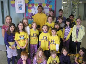 Gore Hill students don their yellow and purple to support Aubri Andre. Curtis Wickham, Gabriella Testani, Ryan Cherneski, Miguel Lazo.  (middle row) Tabytha Knops, Madison Demant, Lily Steinhoff, Owen Jeffery, Ayden Goyeau, Rachel Wong, Kaylie Goodchild; (last row) Ardan Fischer, Abbi Neufeld, Brandi Ribble, Aiden Tavares, Breanna Beaul; (sitting) Zachary Paine, Emily Garton, Natalie Froese, Alexis Beaul, Madison Gagnon. (Bill Cervini/For The Windsor Star)