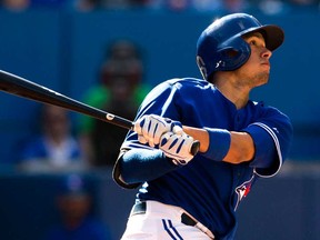 Toronto's Ryan Goins hits a home run against Tampa Bay in Toronto September 28, 2013. Goins will have a chance to compete for the starting job at second base when the Jays open spring training Wednesday in Dunedin, Fla. (THE CANADIAN PRESS/Mark Blinch)