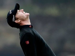 Jimmy Walker celebrates on the 18th green Sunday, Feb. 9, 2014, after winning the AT&T Pebble Beach Pro-Am in Pebble Beach, Calif. (AP Photo/Ben Margot)