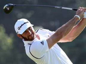 Dustin Johnson watches his shot in the first round of the Northern Trust Open at the Riviera Country Club on February 13, 2014 in Pacific Palisades, Calif. Johnson took the early lead with a 66. (Stephen Dunn/Getty Images)