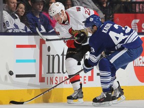 Toronto's Nazem Kadri, right, battles Ottawa's Erik Condra during NHL action at the Air Canada Centre February 1, 2014 in Toronto. (Claus Andersen/Getty Images)