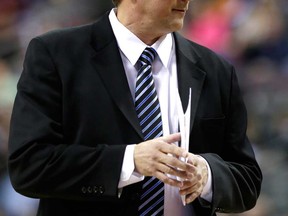 Pistons interim head coach John Loyer stands on the sideline during a game against San Antonio in Auburn Hills, Mich., Feb. 10, 2014. (AP Photo/Carlos Osorio)