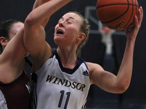 Windsor's Jessica Clemencon, right, battles in the key to get a shot off against McMaster during OUA women's basketball action at the St. Denis Centre, Saturday, Feb. 8, 2014. (DAX MELMER/The Windsor Star)