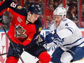 Florida's Shawn Matthias, left, and Toronto's Cody Franson fight for control of the puck February 4, 2014 in Sunrise, Fla.  (Joel Auerbach/Getty Images)