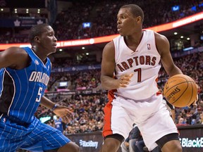 Toronto's Kyle Lowry, right, looks to pass against Orlando's Victor Oladipo in Toronto on Sunday February 23, 2014. (THE CANADIAN PRESS/Chris Young)