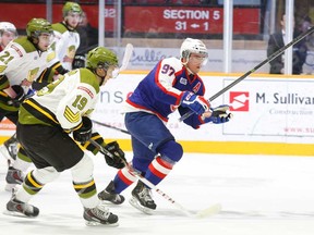 Windsor Spitfire Brady Vail, right, breaks away from the Battalion during OHL action at Memorial Gardens in North Bay Thursday, Feb. 13, 2014. The Battalion won 3-2. (photo by Jennifer Hamilton-McCharles/North Bay Nugget)