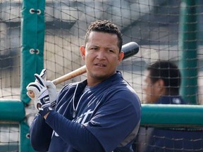 Detroit's Miguel Cabrera prepares for batting practice during spring training last March in Lakeland, Fla. The Tigers are scheduled for their first workout Friday. (AP Photo/Carlos Osorio)