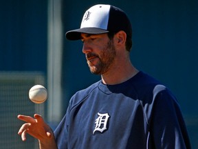 Detroit Tigers pitcher Justin Verlander tosses a ball during the team's first full squad workout of baseball spring training in Lakeland, Fla., Tuesday, Feb. 18, 2014.  (Associated Press/Gene J. Puskar)