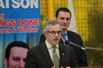 MP and president of the Treasury Board Tony Clement, left, speaks as MP Jeff Watson looks on at   Centerline in Windsor,  Ontario on Feb 18, 2014. (JASON KRYK/The Windsor Star)