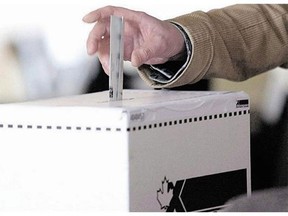 A man casts his vote in a Canadian election. (Canadian Press files)