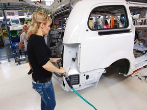 A worker on the production line at Chrysler's assembly plant in Windsor, works on a minivan on January 18, 2011.  One analyst suggest Canada could lose its auto industry completely over the next 15 to 25 years. (The Canadian Press/Geoff Robins)
