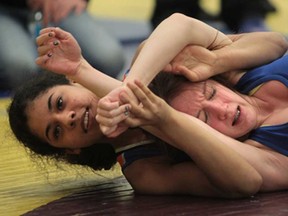 Sandwich's Jasmine Sanders, left, and Tecumseh Vista's Meghan Pongratz wrestle during the WECSSAA championships at Tecumseh Vista Academy on February 12, 2014 in Tecumseh. (JASON KRYK/The Windsor Star)