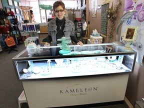 Jackie McCreary, co-owner of From the Heart on Ottawa Street, says customers are going crazy for Kameleon, a Canadian jewelry line that lets you change up your rings, pins, bracelets and pendants by popping out one stone and replacing it with another. (DAN JANISSE / The Windsor Star)