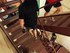 You'll burn about 29 calories climbing stairs for three minutes -- proof that the steps in your office or home are really exercise equipment hiding in plain sight! (Colleen De Neve / Postmedia News files)