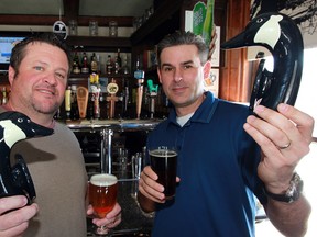 Trevor Loop, left, of Jack's Gastropub and hop farmer Doug Sinclair have the tap heads ready for their Banded Goose Brewery venture, March 7, 2014.  The two will produce small batches of brew and are waiting government approval to sell the craft beers they produce. (NICK BRANCACCIO/The Windsor Star)