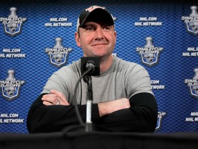 New Jersey Devils head coach Peter DeBoer talks to the media during a news conference in Newark, N.J., in May 2012. (Canadian Press files)