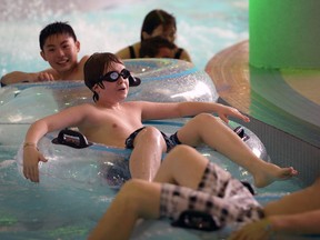 Soushi Ukai, 12, top, Rocco Soave, 12, and Aaron Dot, right, enjoy Lazy River portion of Windsor's Adventure Bay Water Park Tuesday March 11, 2014.  Big crowds have attended during March Break. (NICK BRANCACCIO/The Windsor Star)