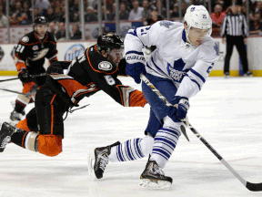 Toronto's James van Riemsdyk, right, is checked by Anaheim's Ben Lovejoy Monday in Anahiem. (AP Photo/Jae C. Hong)