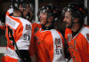 Essex forwards Scott Bromley, from left, Daniel Slipchuck, and Dylan Solecki celebrate a third-period goal against the Belle River Canadiens Tuesday in Essex. (DAX MELMER/The Windsor Star)