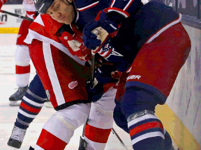 Kingsville's Dalton Prout, right, checks Detroit's Todd Bertuzzi Tuesday at Nationwide Arena in Columbus. (Photo by Kirk Irwin/Getty Images)